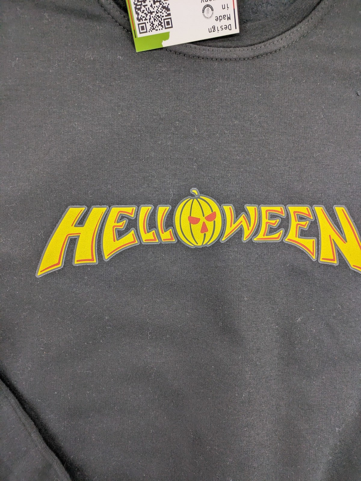 Helloween orange sweatshirt featuring iconic band logo in yellow, soft cotton blend material.