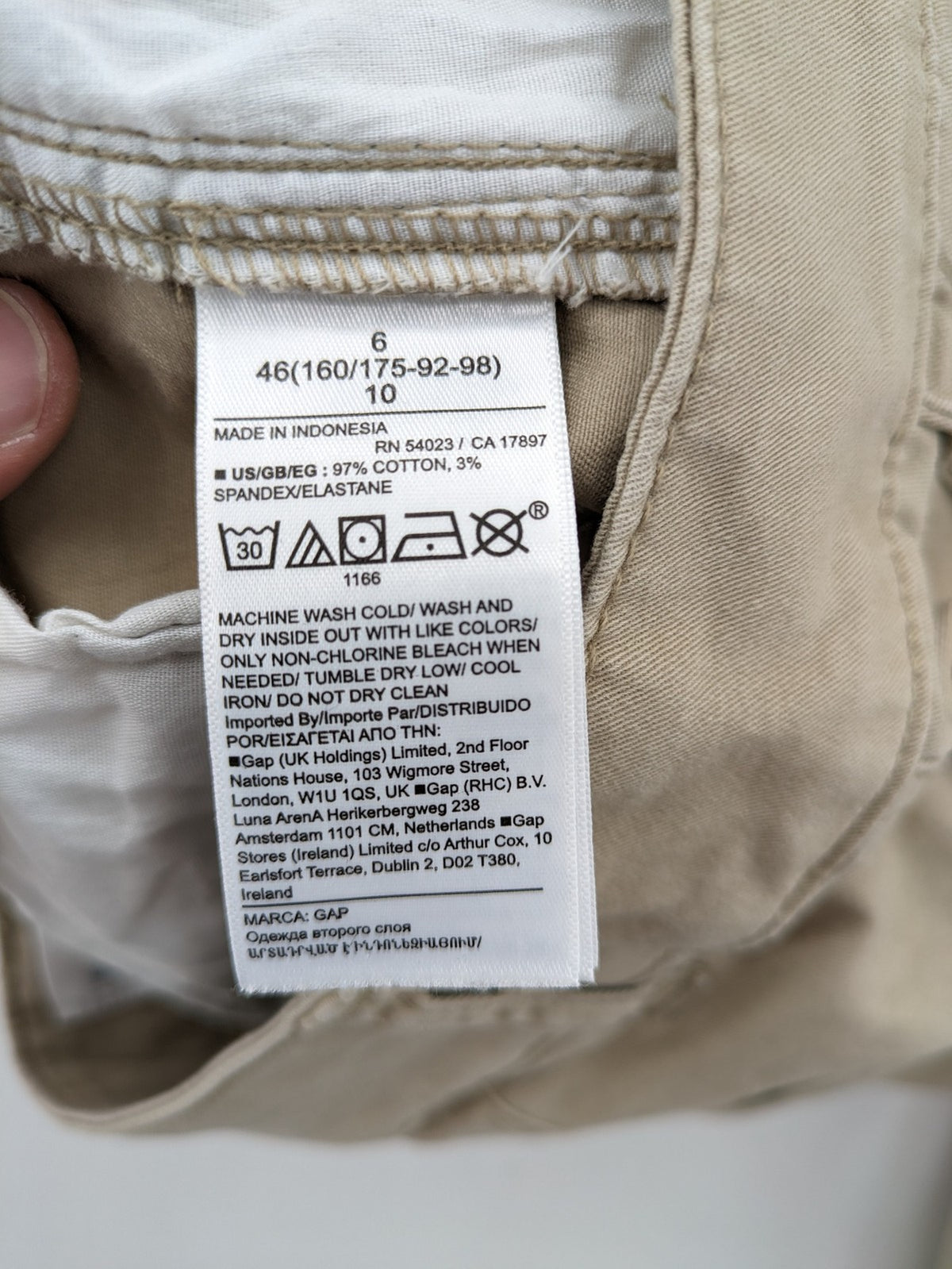 Gap beige girlfriend chino pants with relaxed fit and soft cotton-stretch blend.