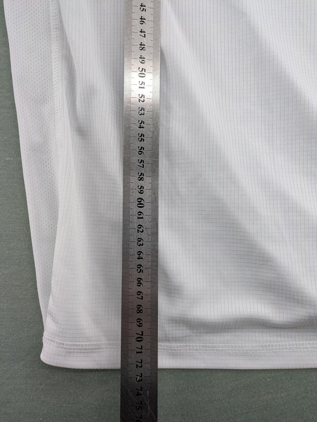 Smilodox white workout t-shirt with logo on chest and reflective detail on back.