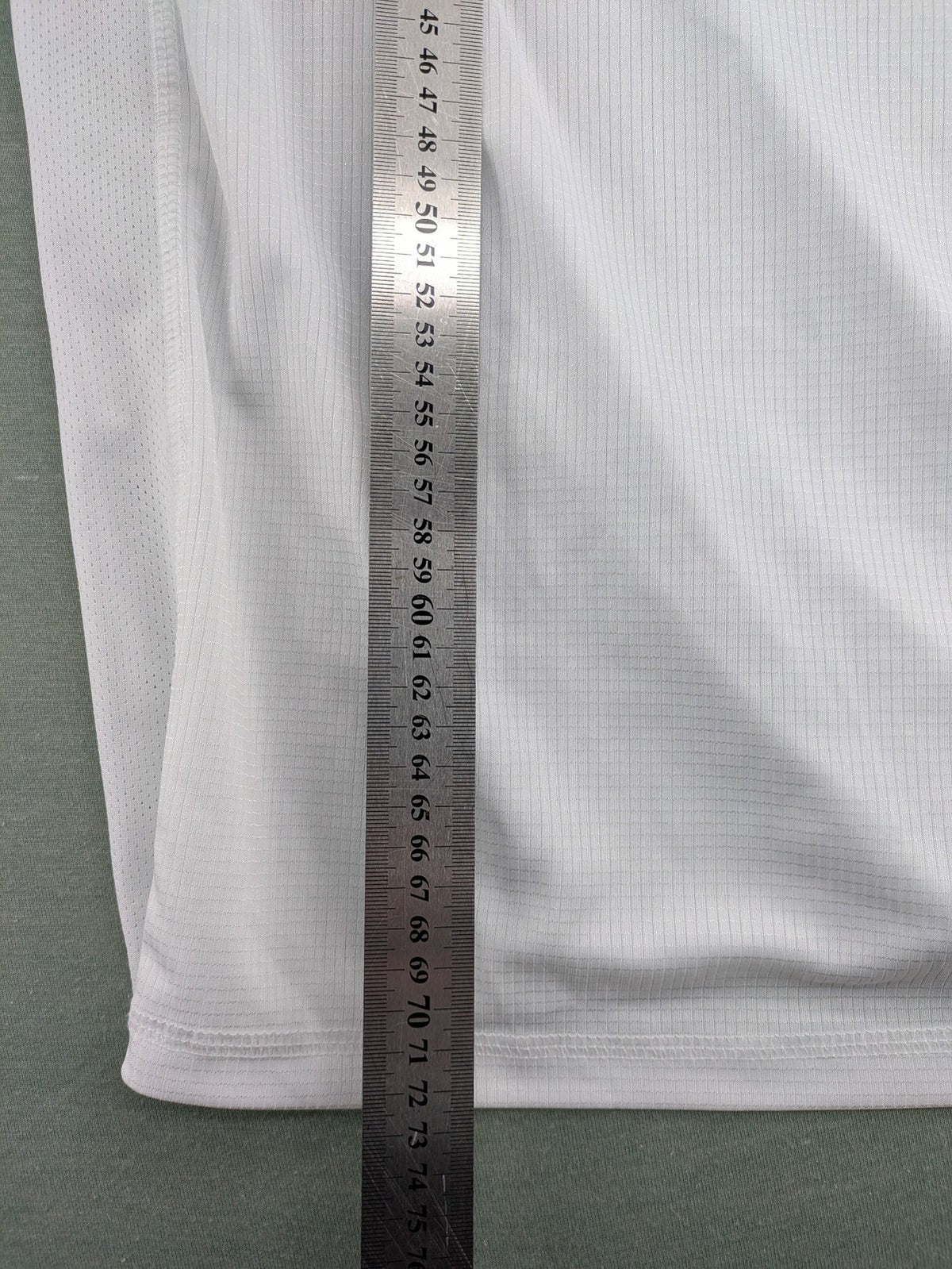 Smilodox white workout t-shirt with logo on chest and reflective detail on back.