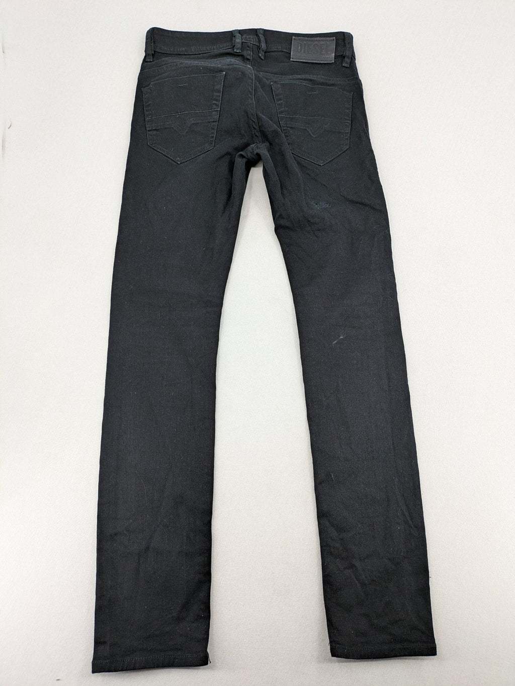 Diesel black Thommer Slim jeans with classic 5-pocket design and stretch material.