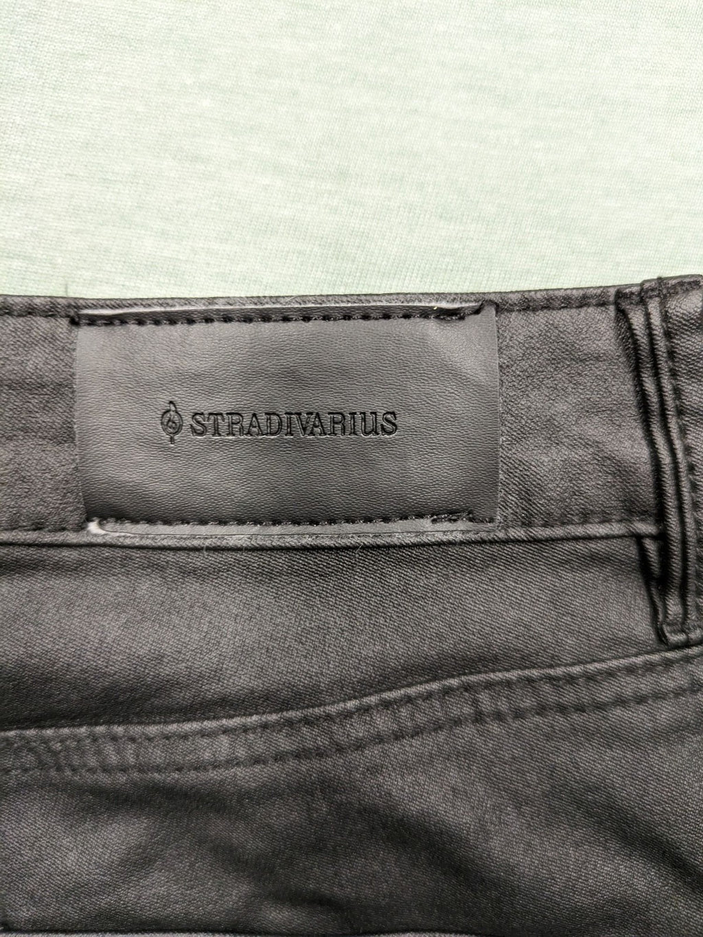 Stradivarius black coated skinny jeans faux leather finish stylish silhouette