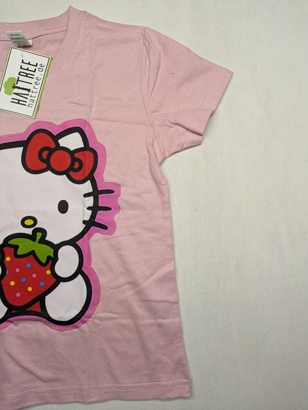 Hello Kitty multi T-shirt pink with large strawberry graphic and short sleeves.