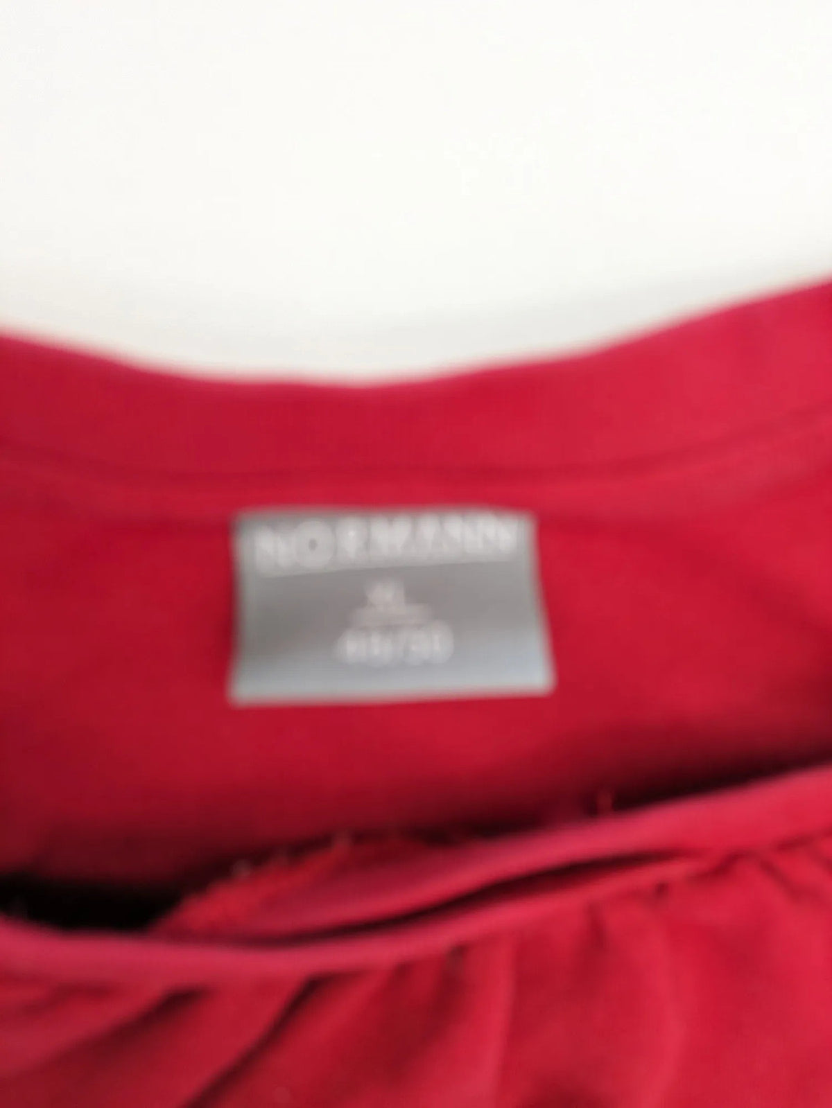 Normann red turtle neck jumper with large anchor print and side pockets.