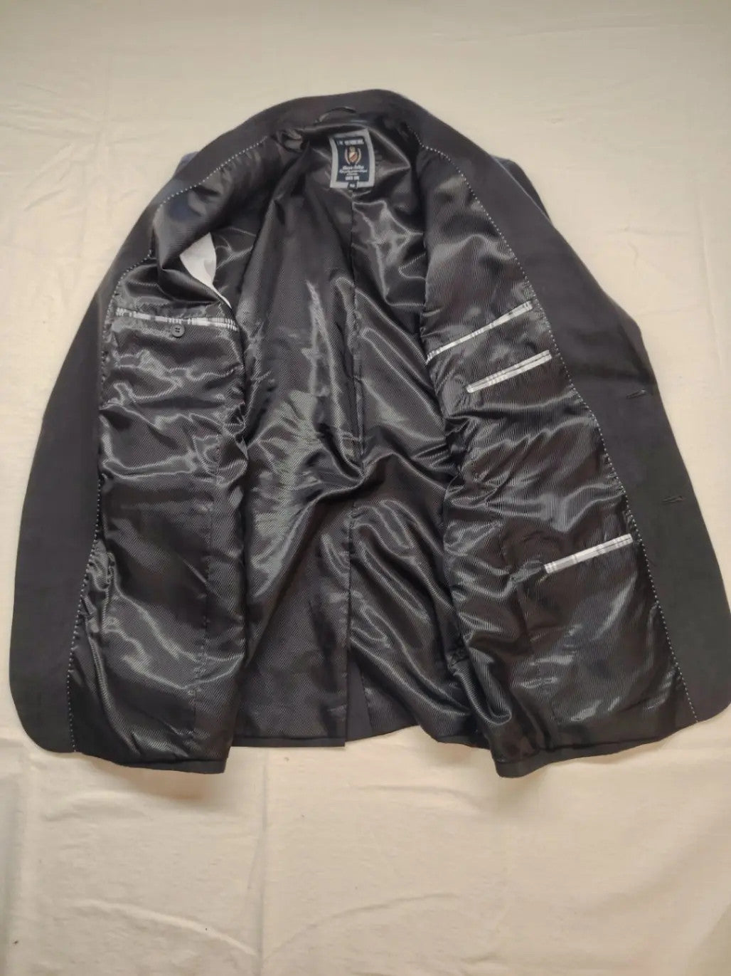 dunmore black blazer two-button design with falling lapels and multiple pockets