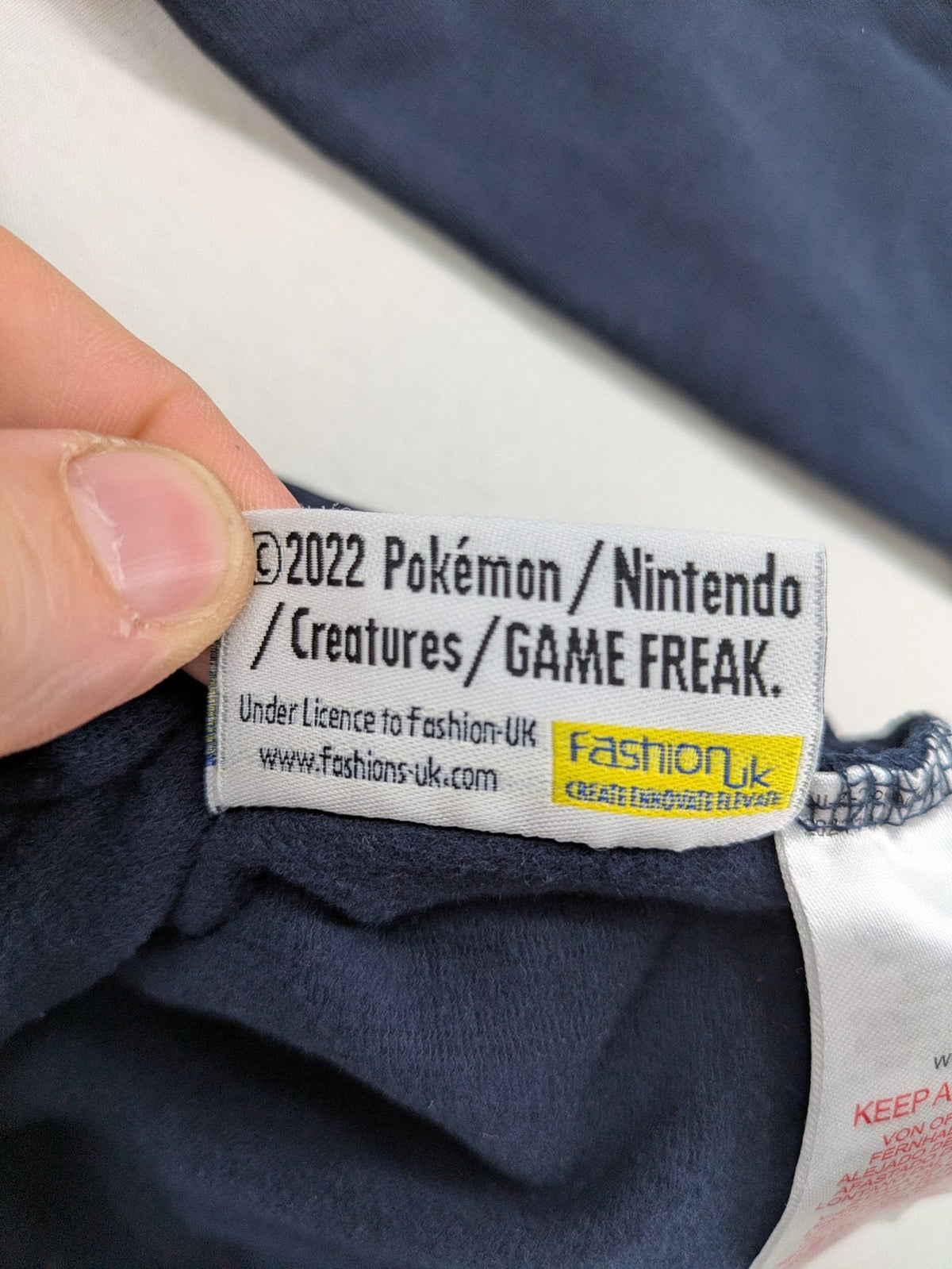 name it turtle neck jumper dark blue large Pikachu graphic print 2022