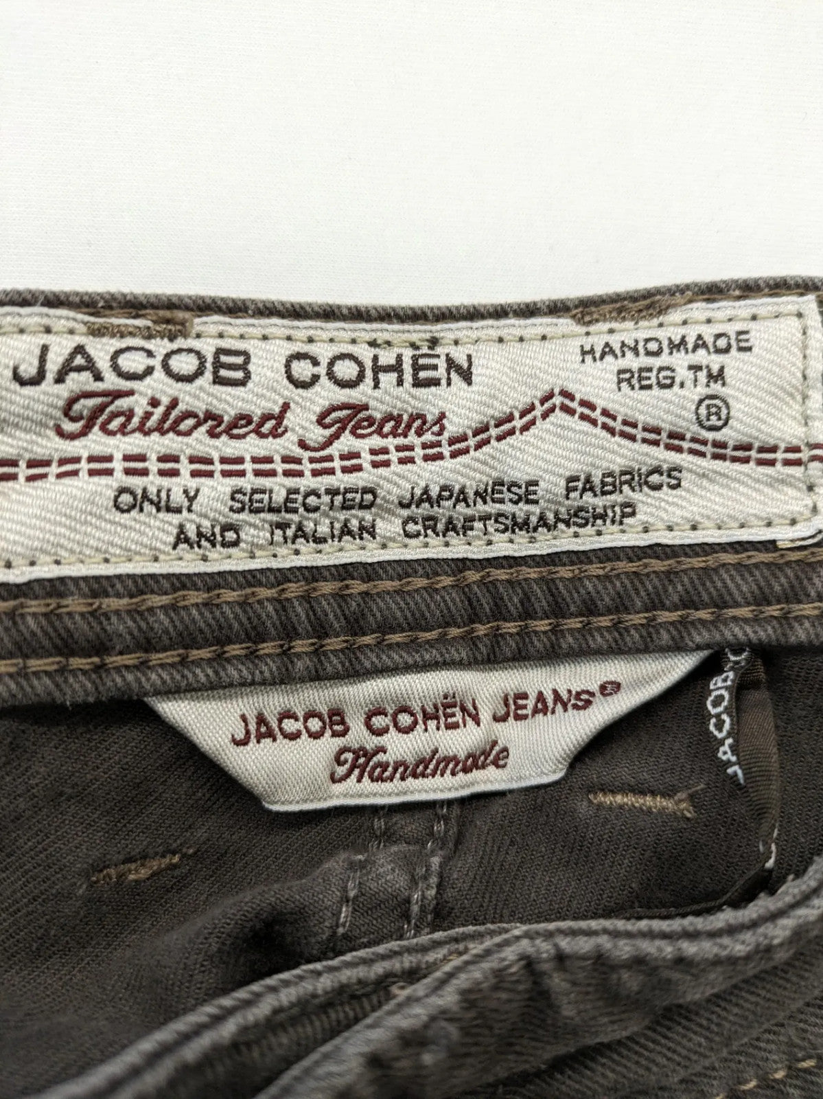 Jacob Cohen black straight jeans with leather logo patch and zip fly, size 32.