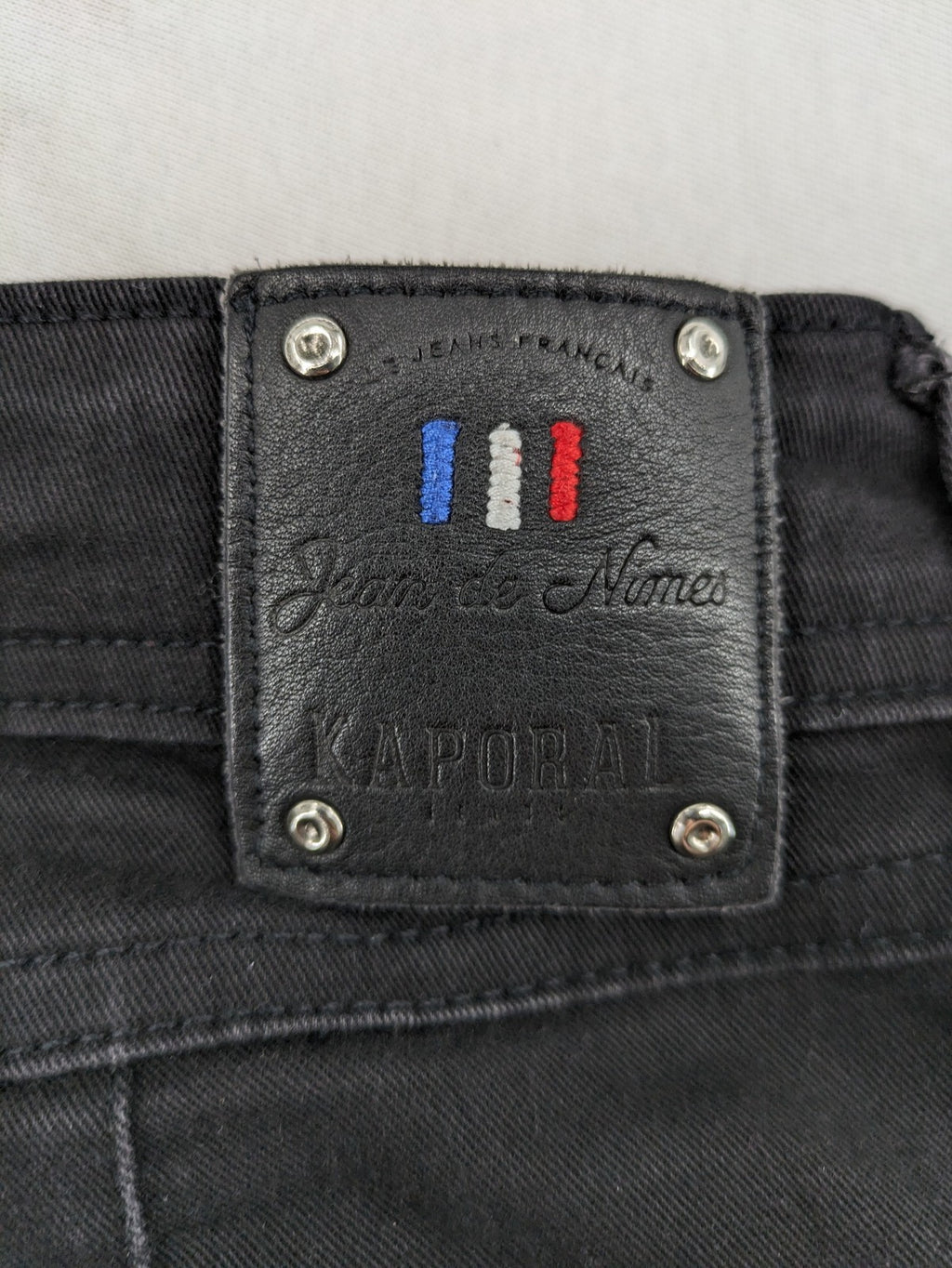 Kaporal black slim fit jeans with classic 5-pocket design and stretch denim material.
