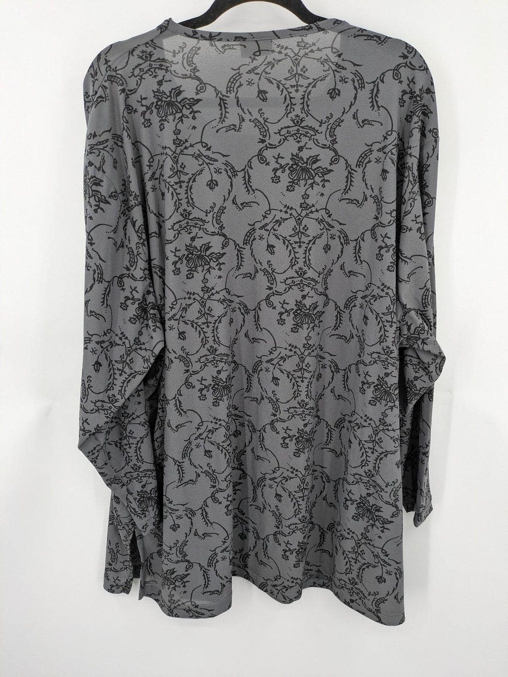 Yessica grey black floral pattern tunic top with round neckline and long sleeves.
