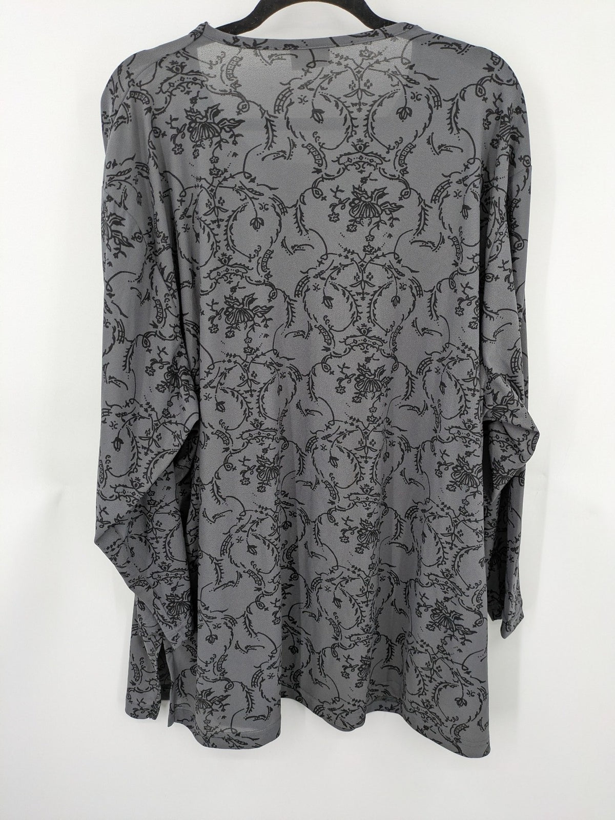Yessica grey black floral pattern tunic top with round neckline and long sleeves.