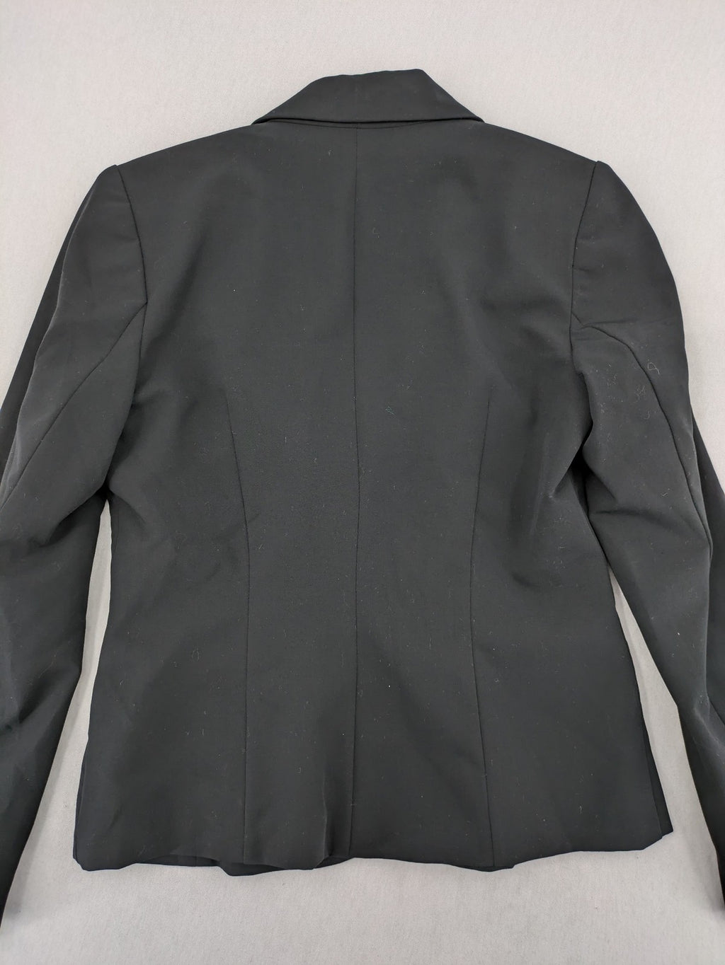 Lindex black blazer coat two-button design with subtle embroidery and tailored silhouette.