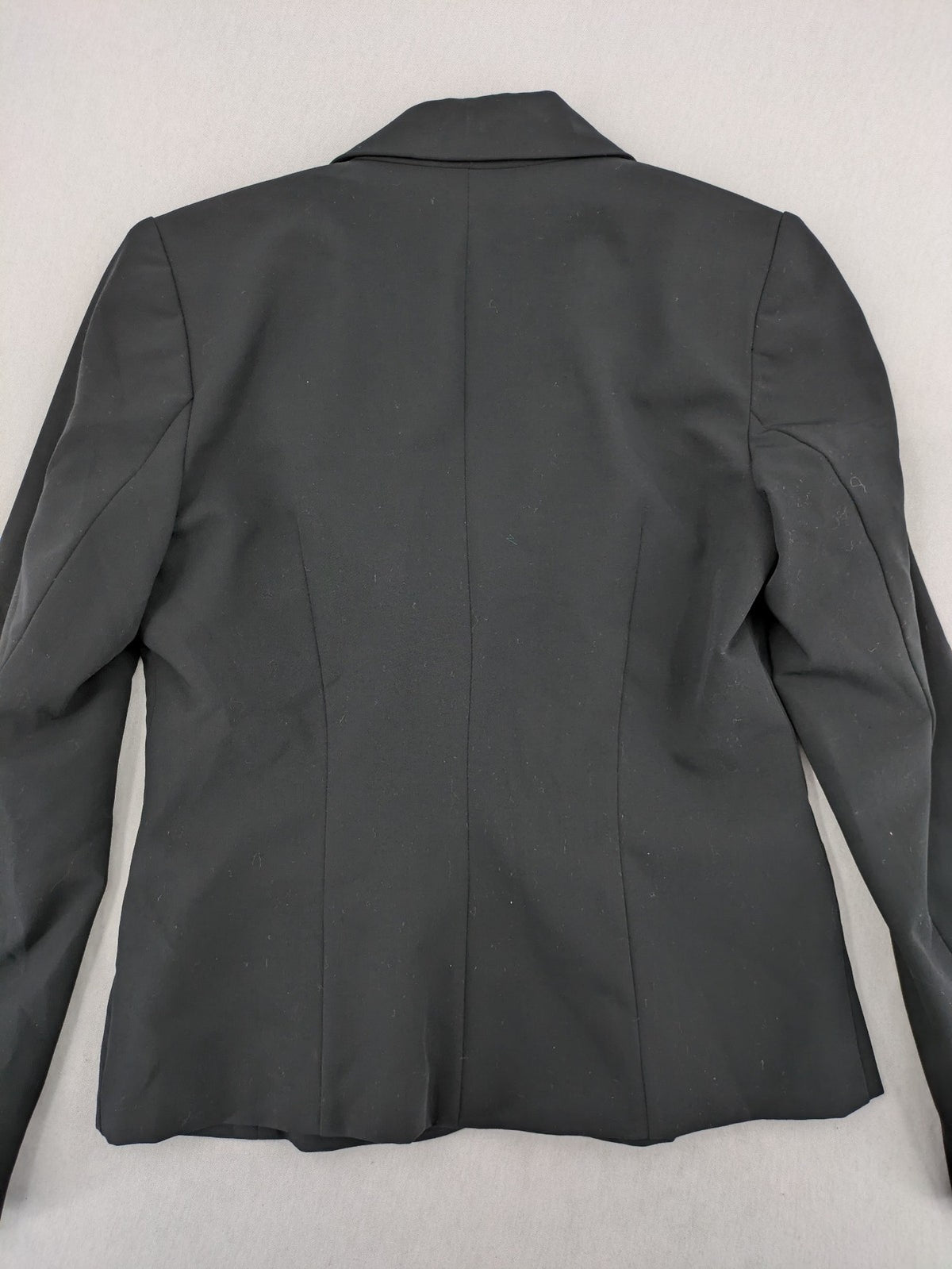 Lindex black blazer coat two-button design with subtle embroidery and tailored silhouette.