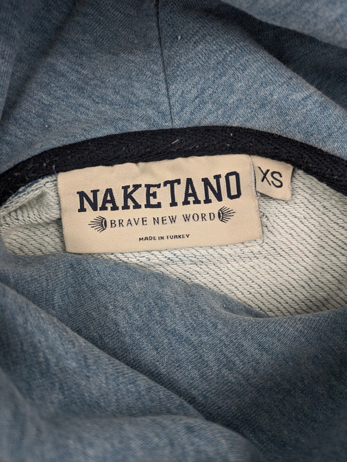 Naketano blue turtle neck jumper with unique collar and artistic leather details