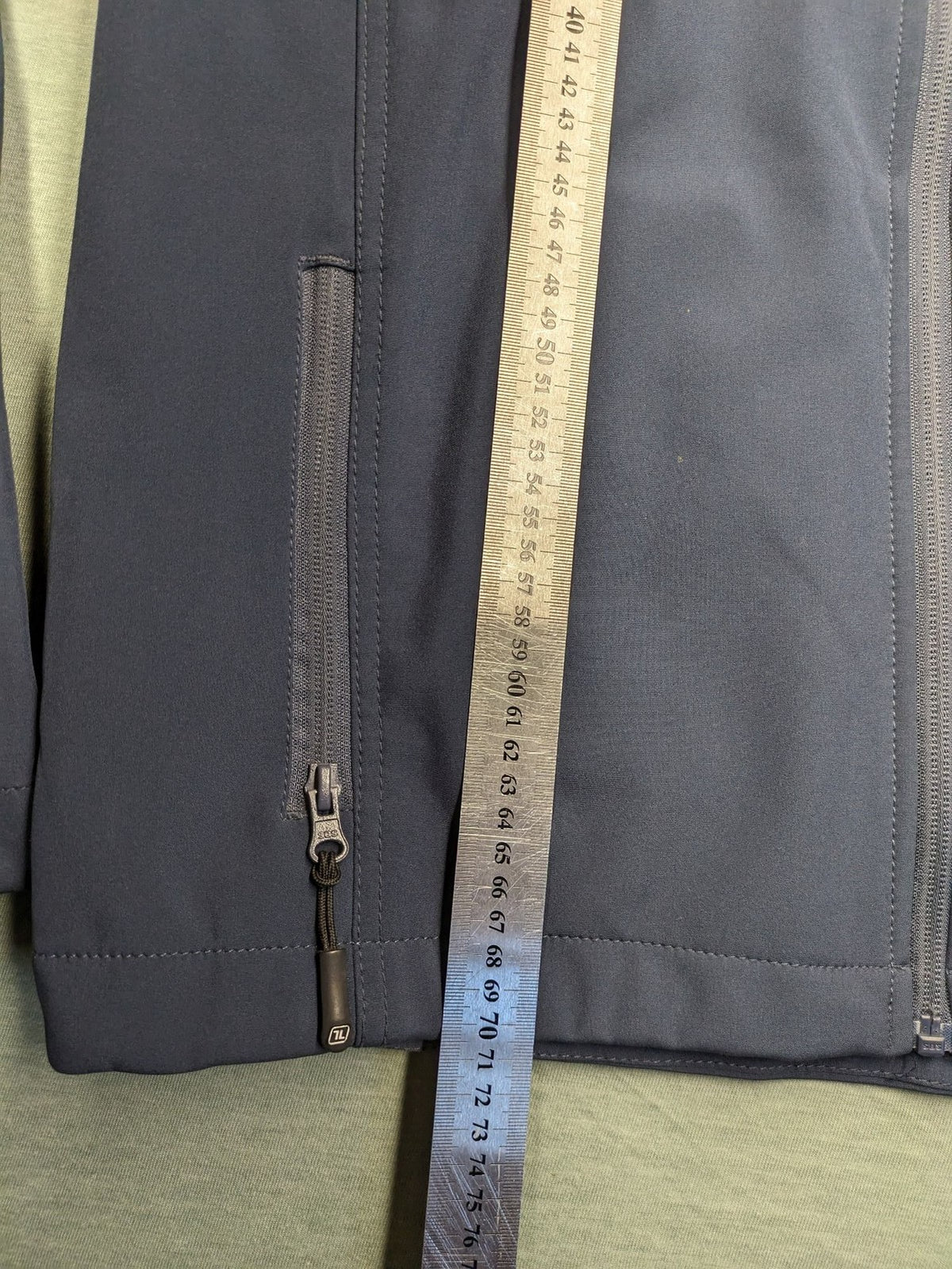 Life Line grey softshell jacket with adjustable hood and durable wind-resistant material.