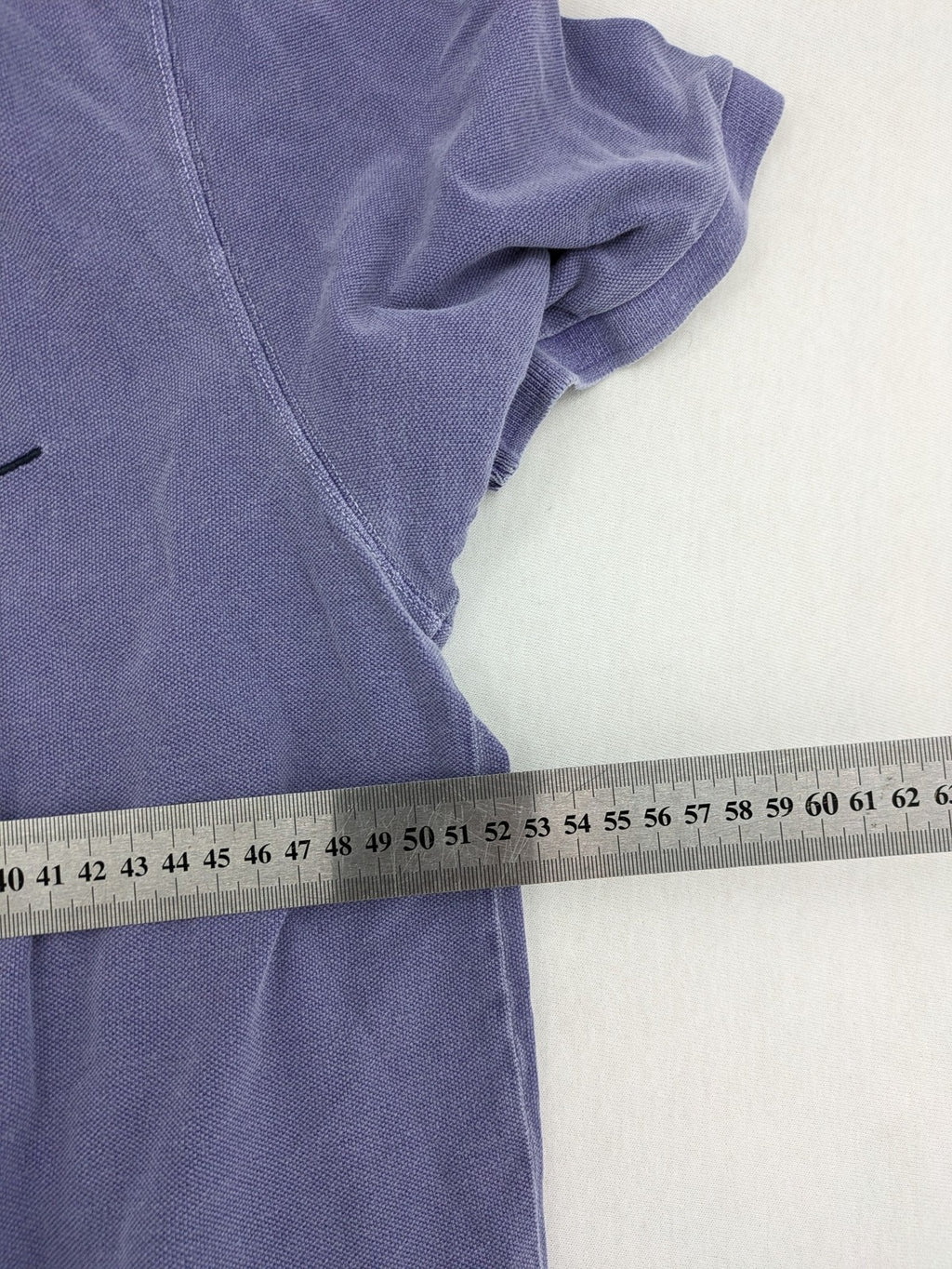 Marc O'Polo purple polo shirt garment dyed cotton with embroidered logo and intricate details.