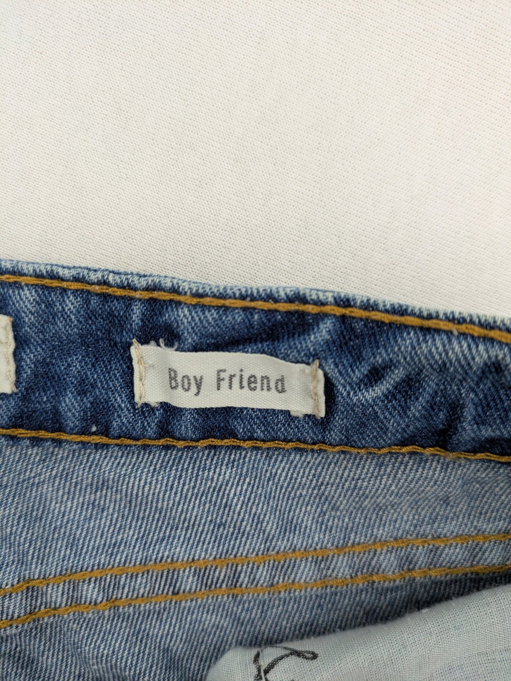 Daysie blue boyfriend jeans shorts with distressed rips and classic 5-pocket design.