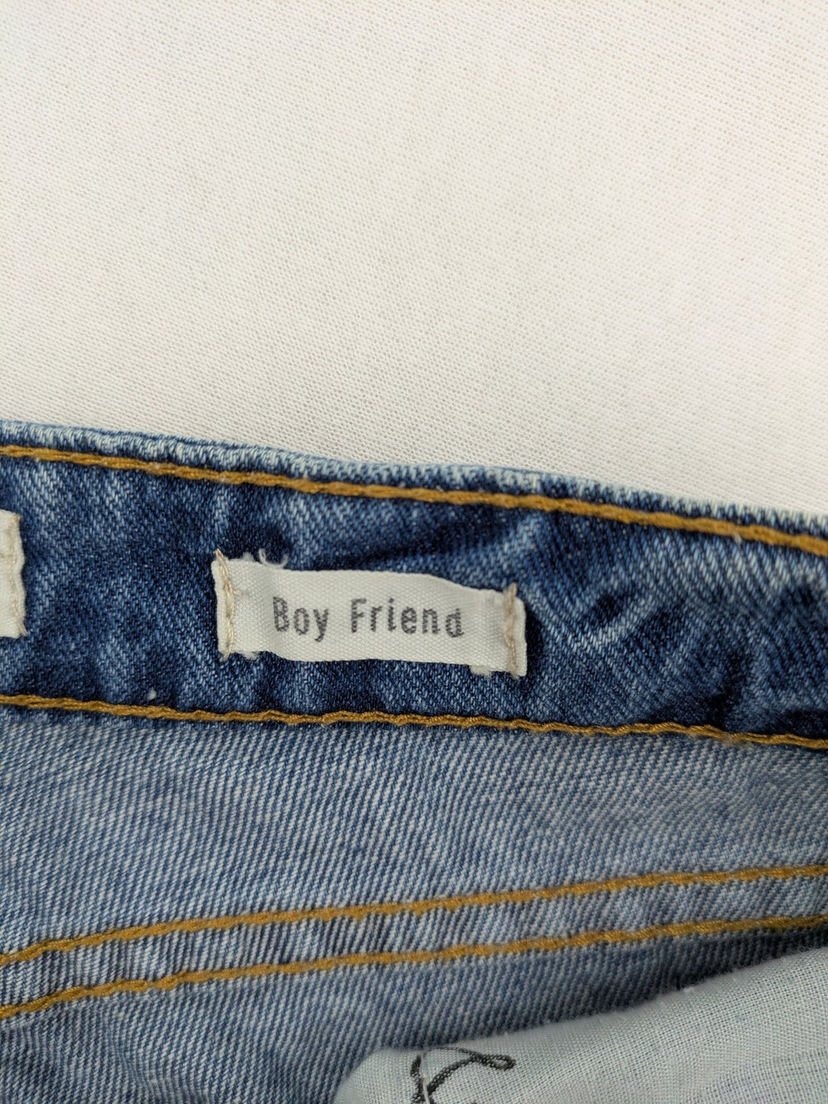Daysie blue boyfriend jeans shorts with distressed rips and classic 5-pocket design.
