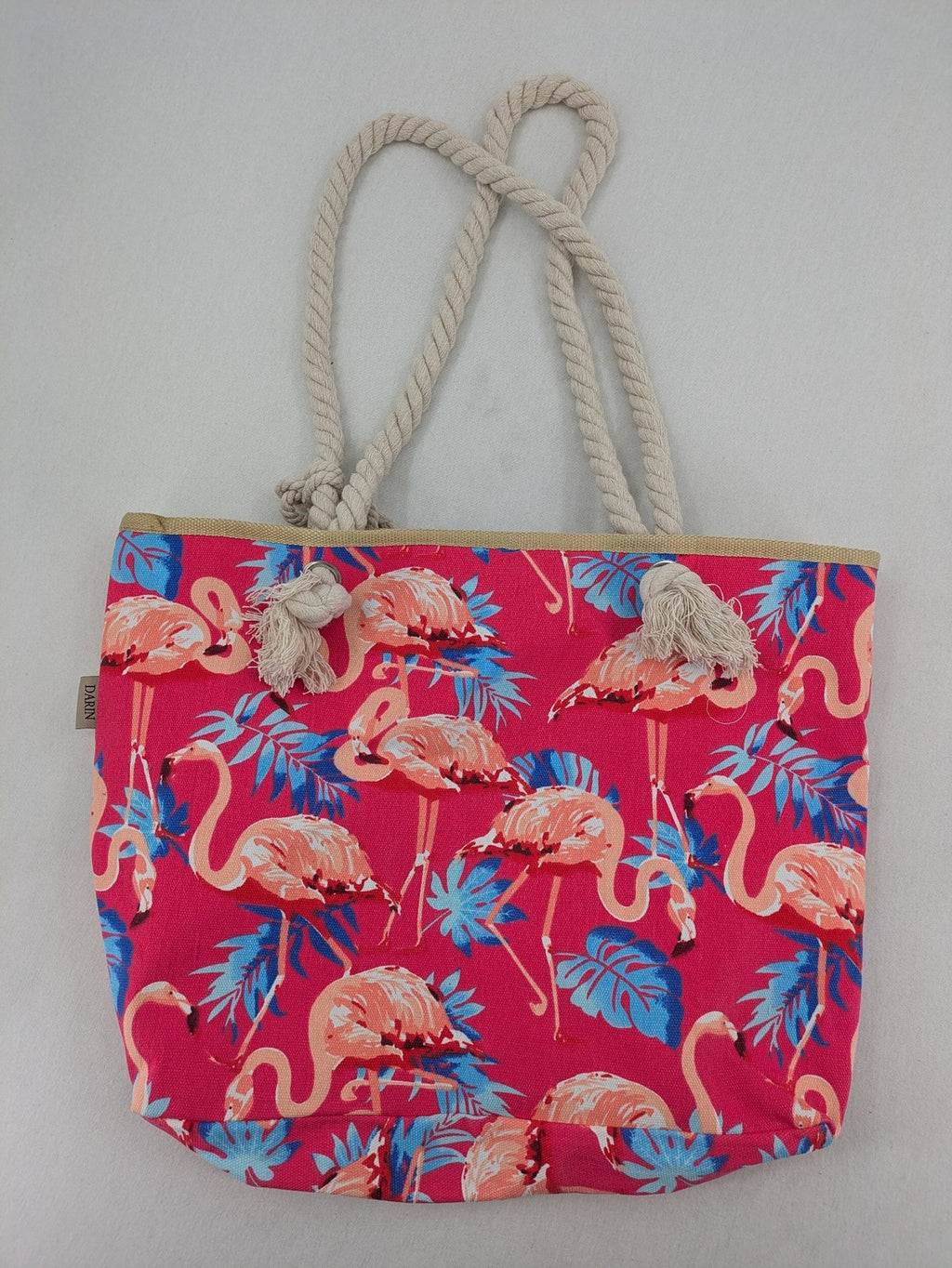 Flamingo pink shopping tote with vibrant tropical flamingo and palm leaf pattern.