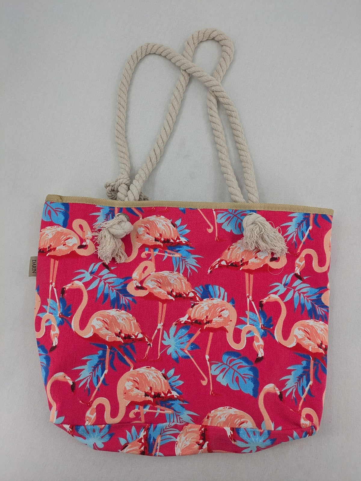 Flamingo pink shopping tote with vibrant tropical flamingo and palm leaf pattern.