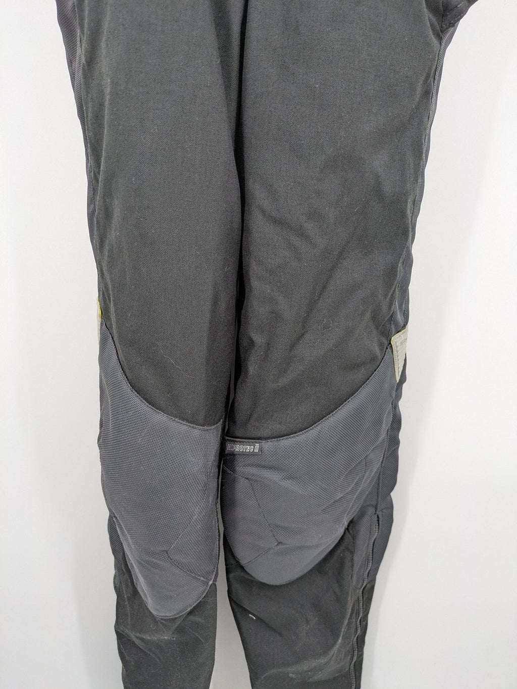 Hein Gericke black chaps with adjustable suspenders, made from durable Cordura and Kevlar.