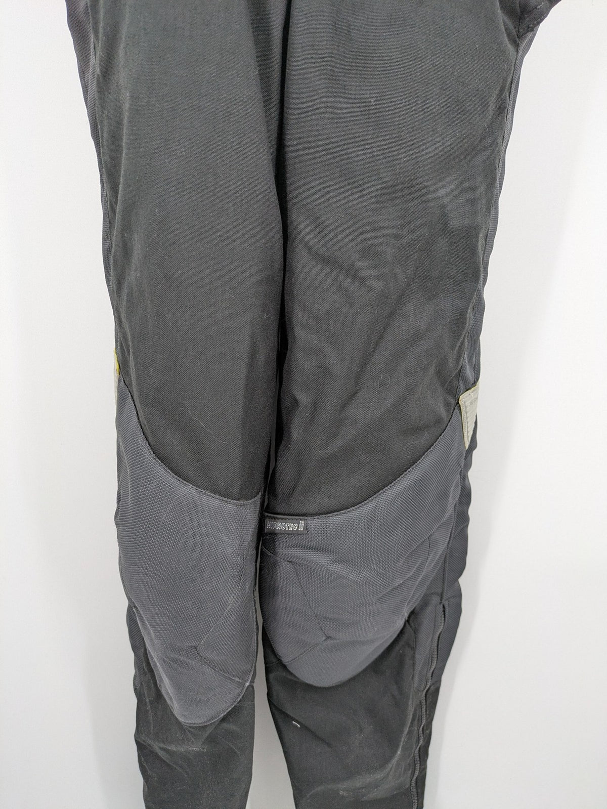 Hein Gericke black chaps with adjustable suspenders, made from durable Cordura and Kevlar.