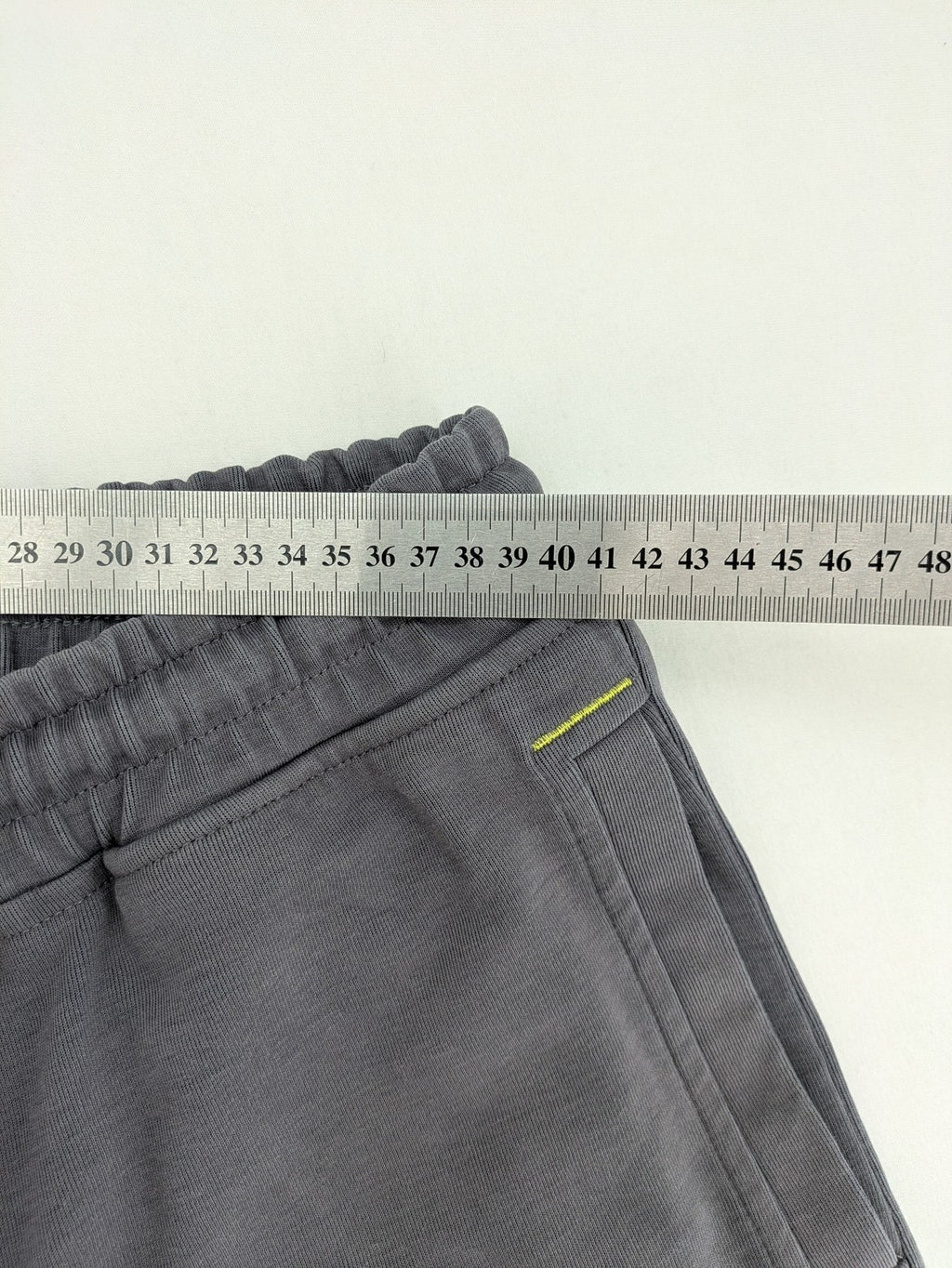 US Polo Assn grey sweatpants with light green drawstring and subtle logo detail.