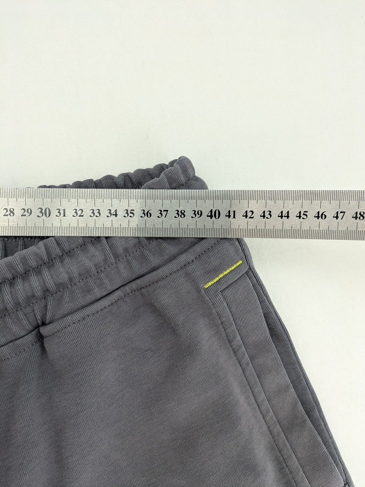 US Polo Assn grey sweatpants with light green drawstring and subtle logo detail.