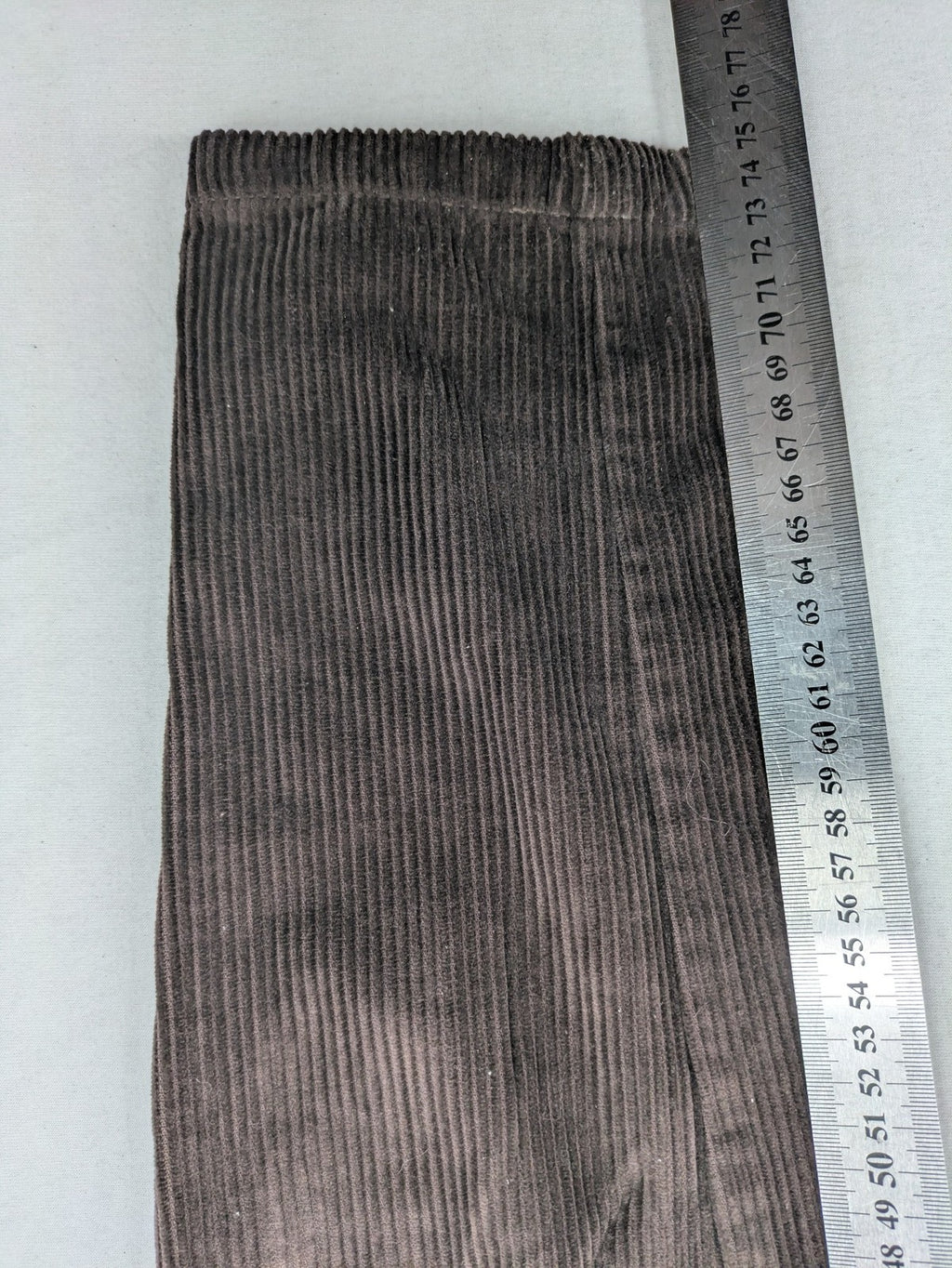 Alma & Lovis brown cord pants paperbag style with belt, made from organic cotton.