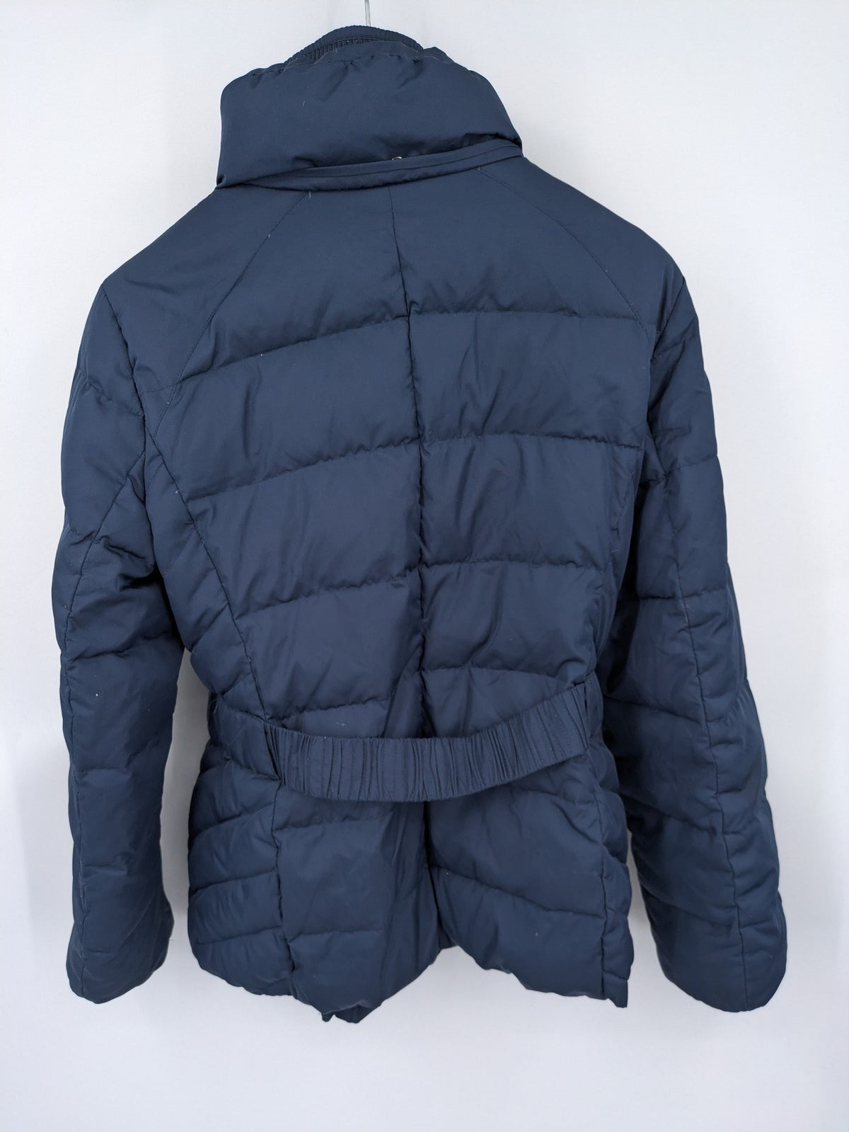 Esprit navy puffer jacket with belt, high collar, ribbed inner lining, and button placket.