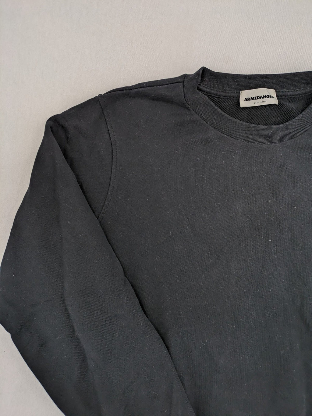 Armedangels black turtle neck jumper with embroidered logo, made from 100% organic cotton.