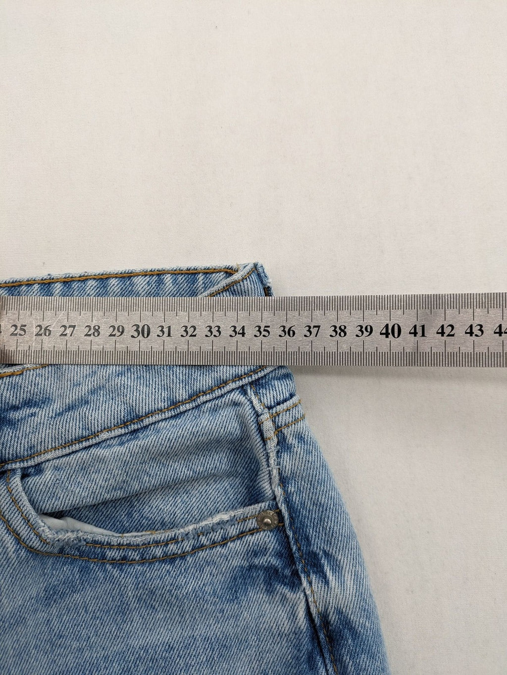 FB Sister blue straight leg jeans high rise with distressed detailing and button fly.