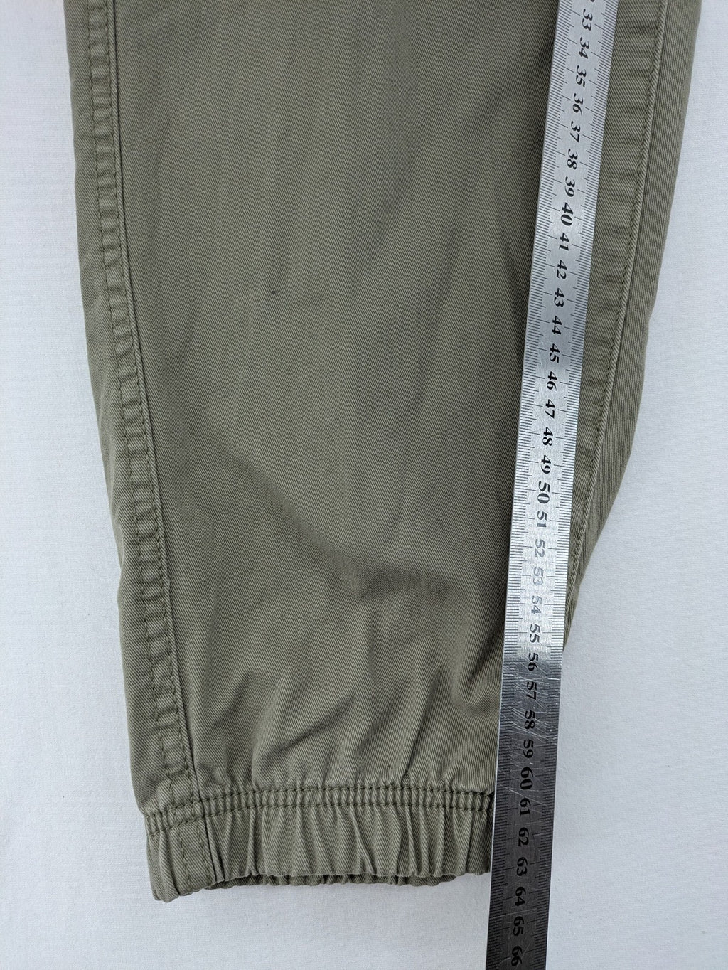 Y.F.K. khaki cargo pants with elastic cuffs, side pockets, and drawstring waistband.