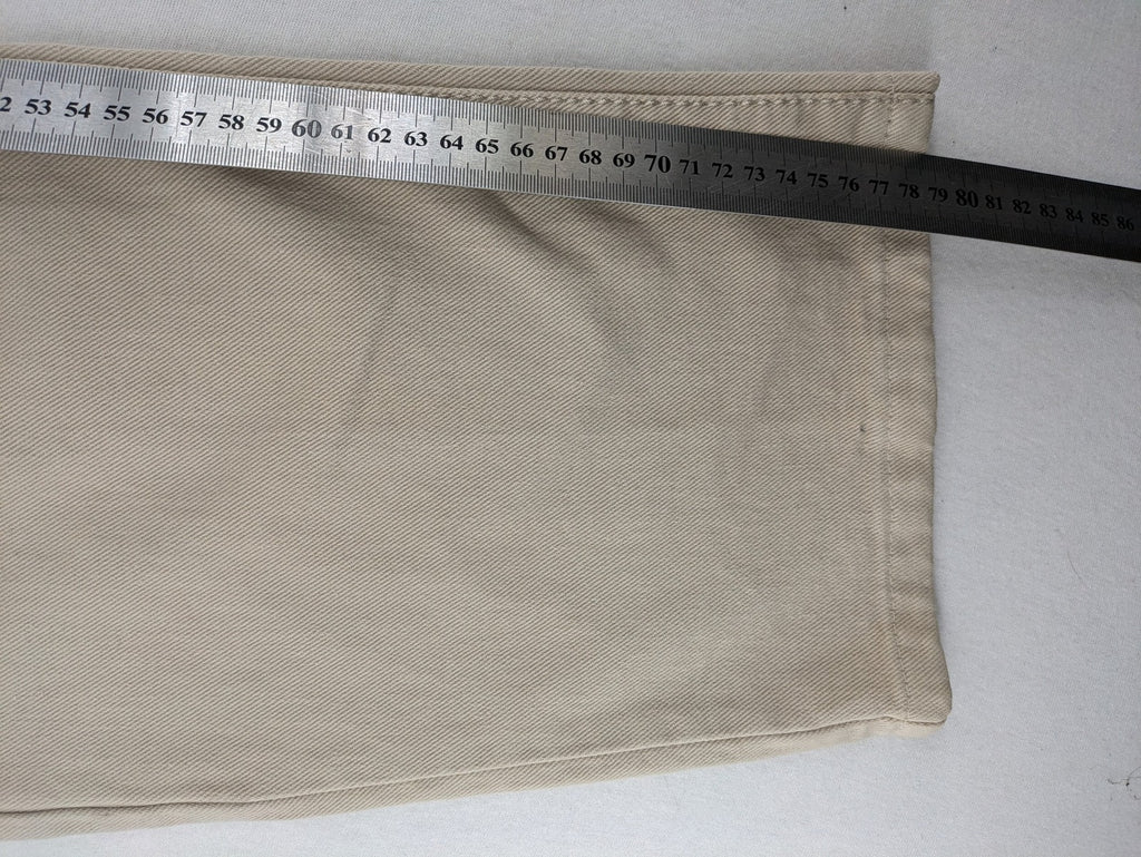 Joker beige straight jeans 5-pocket design with zipper and button closure.