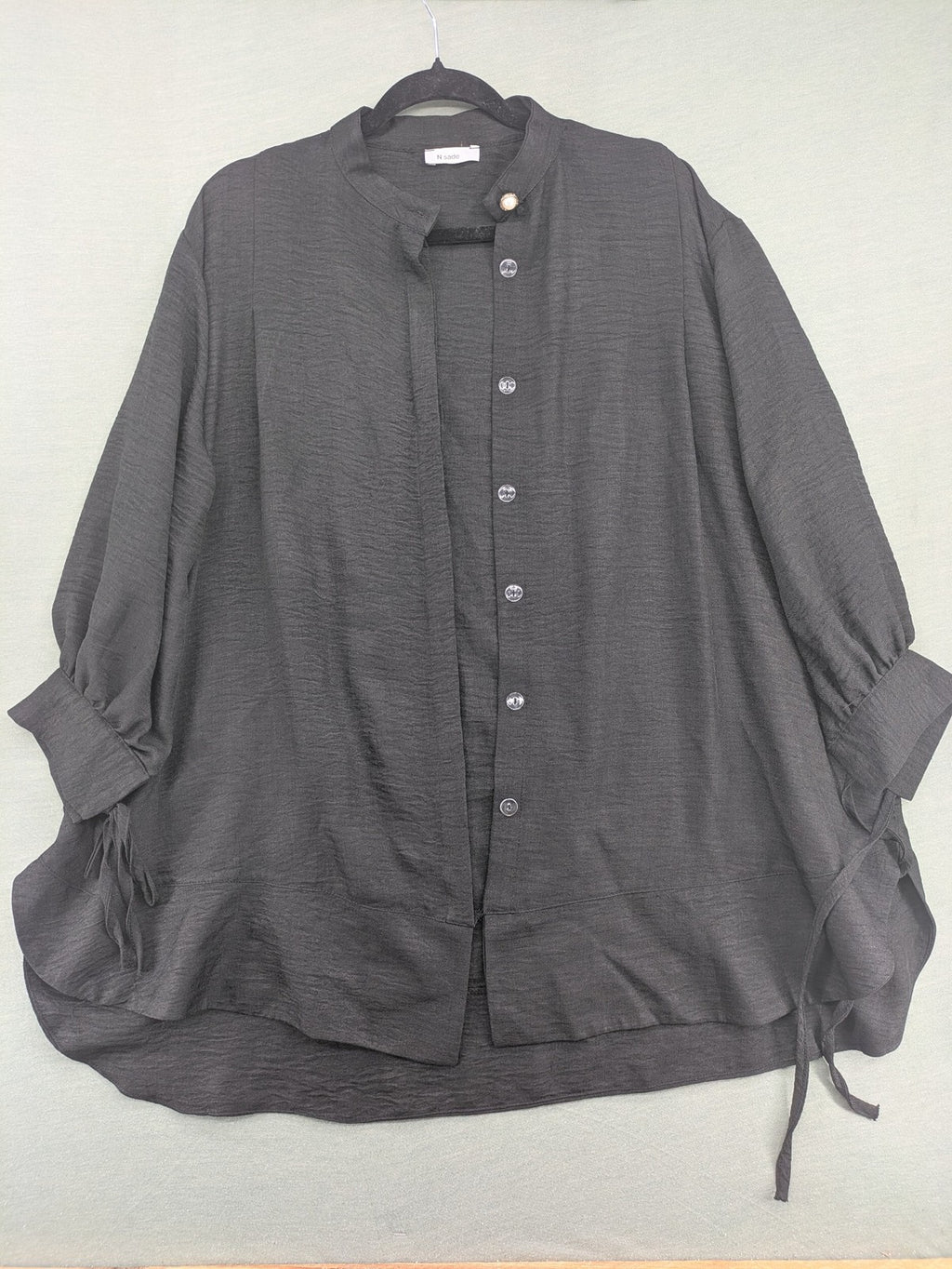 Damen grey turtle neck jumper with balloon sleeves and side ties, high-low hem.