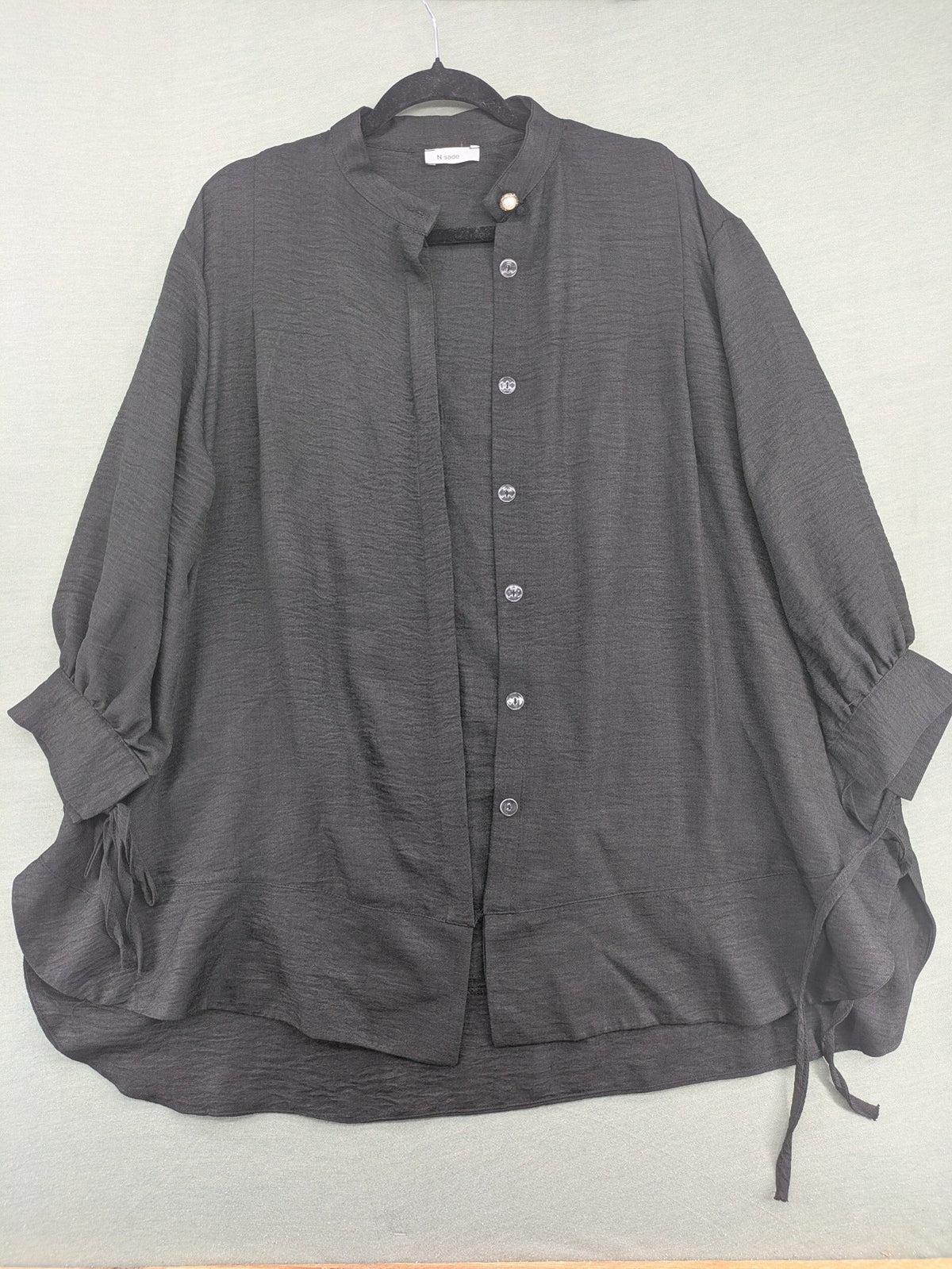Damen grey turtle neck jumper with balloon sleeves and side ties, high-low hem.