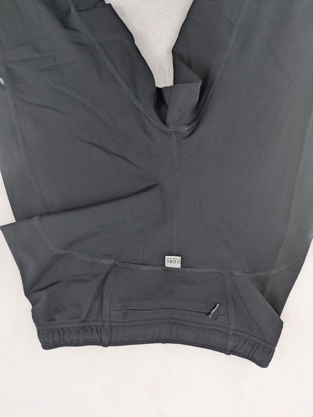 GORE RUNNING WEAR black bicycle tights with reflective details and zippered ankle openings.