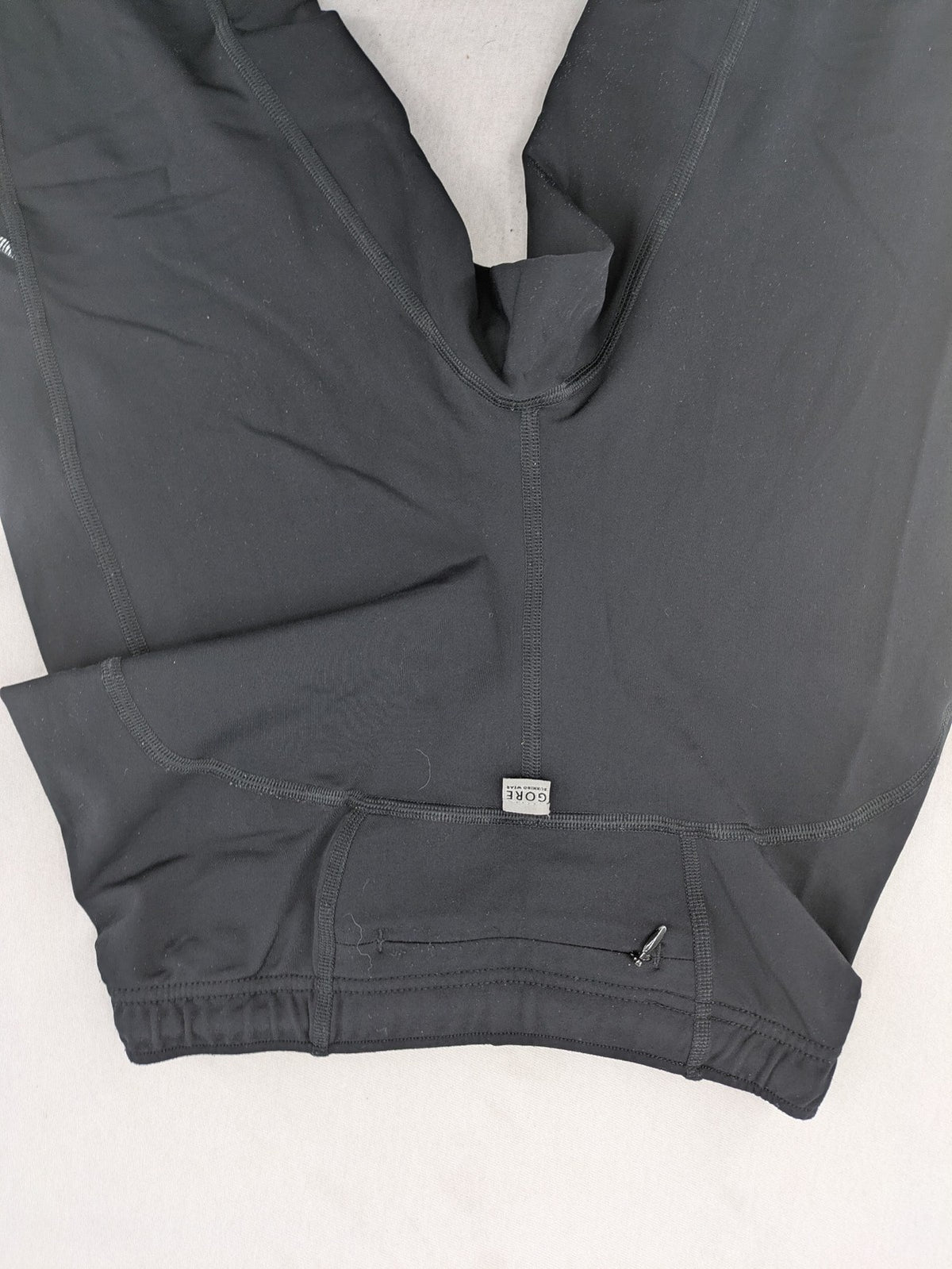 GORE RUNNING WEAR black bicycle tights with reflective details and zippered ankle openings.