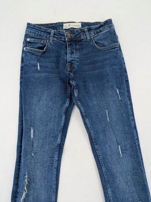 2Y Premium blue skinny jeans with distressed details and classic button fly.