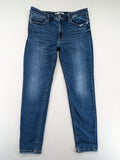 Stradivarius blue low waist skinny jeans with subtle fading and classic denim texture.