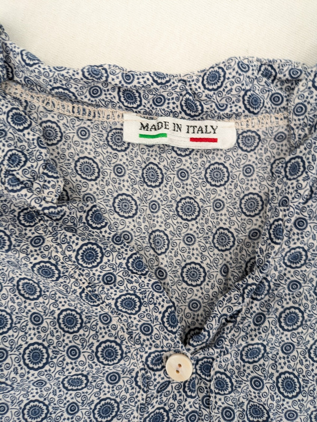 M/L blue and grey tunic top with geometric pattern and stand-up collar.