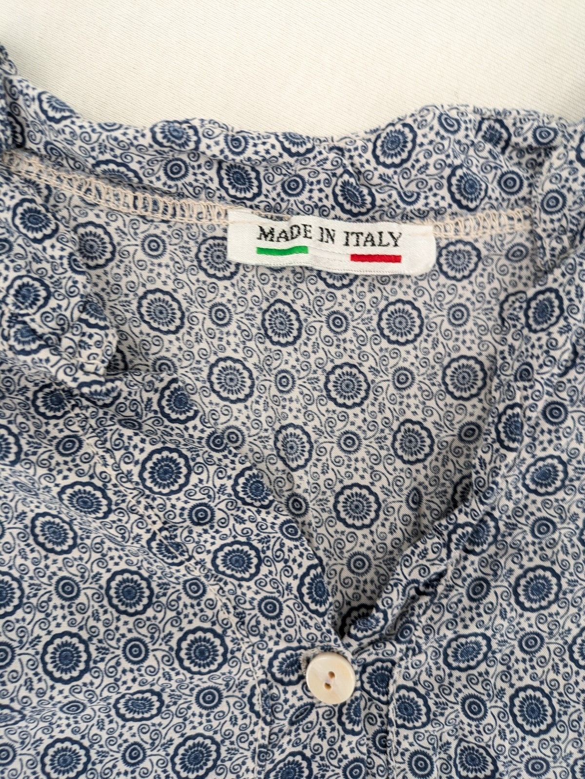 M/L blue and grey tunic top with geometric pattern and stand-up collar.