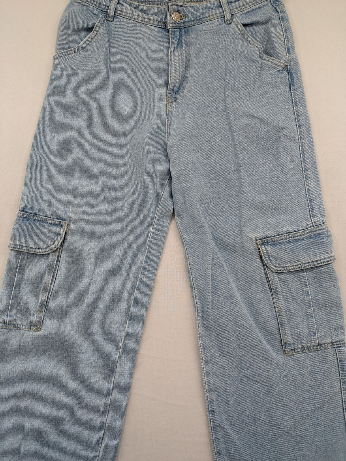 MNG blue straight jeans with cargo pockets and raw hem, high waist denim.