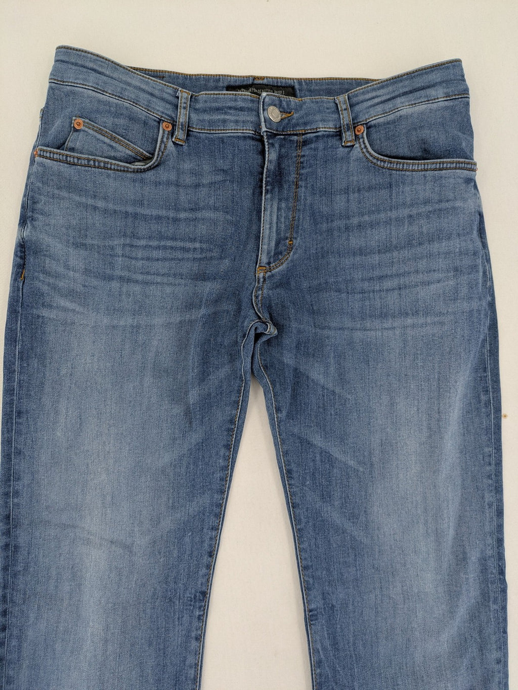 Drykorn blue straight jeans with stretch denim, classic fit, and logo patch on waistband.