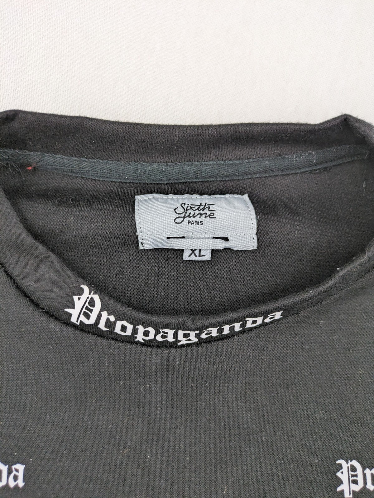 Sixth June black sweatshirt with Gothic "Propaganda" graphic print and logo details.