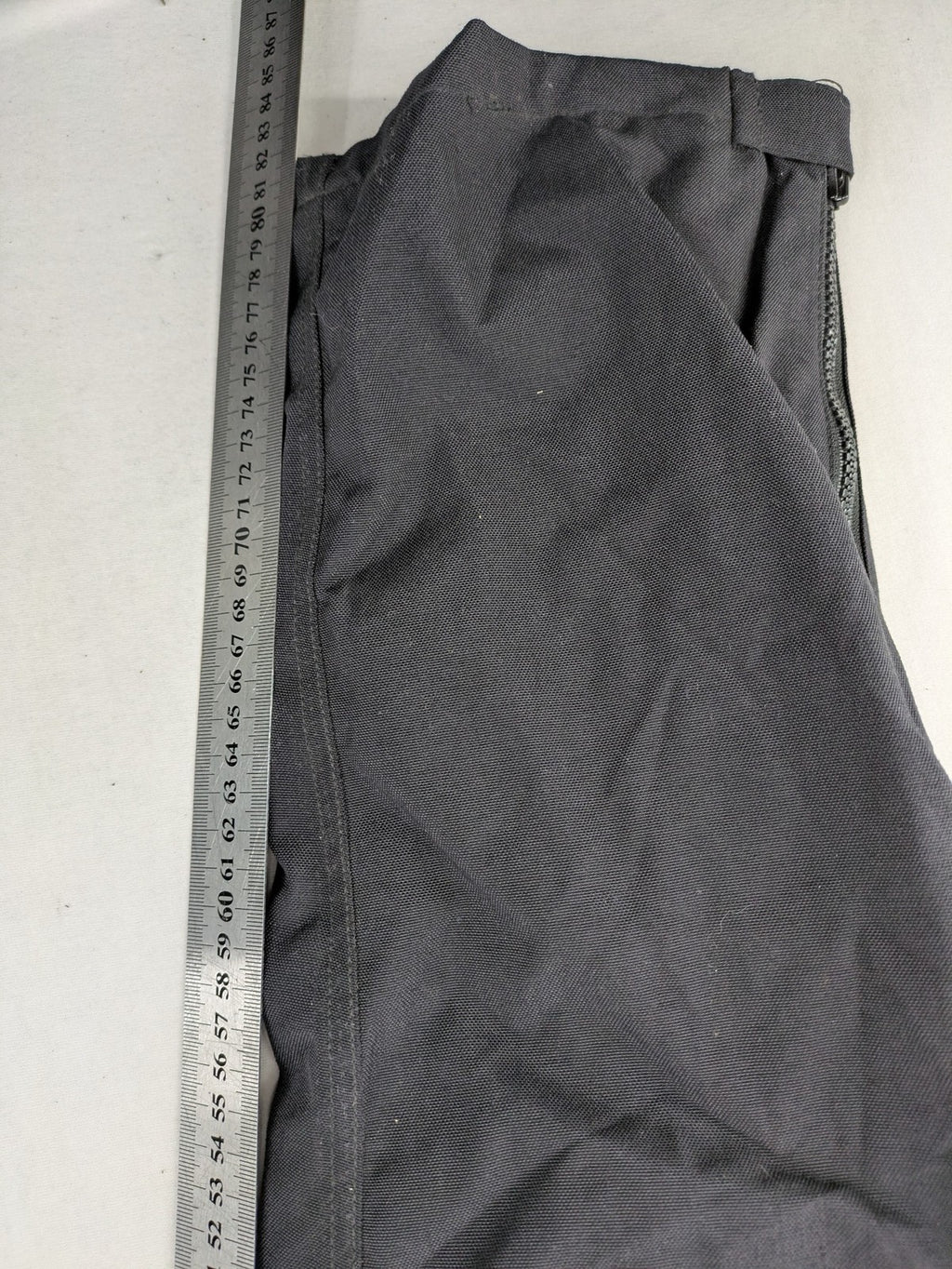 Aero black chaps Cordura fabric with ribbed knee inserts and adjustable waistband.