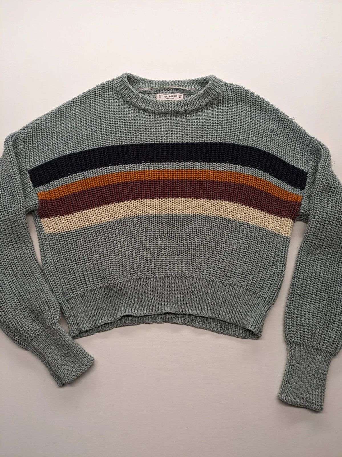 Pull&Bear beige turtle neck jumper with block stripe pattern and ribbed knit texture.
