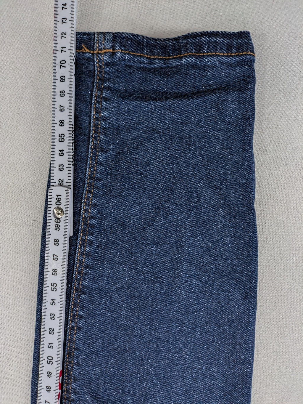 Denim & Co. blue skinny stretch jeans, five-pocket design, dark wash, durable material.