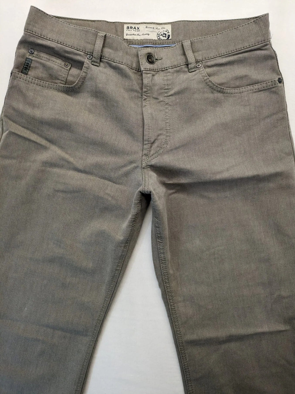 BRAX grey straight jeans 5-pocket design with zipper fly and soft fabric.