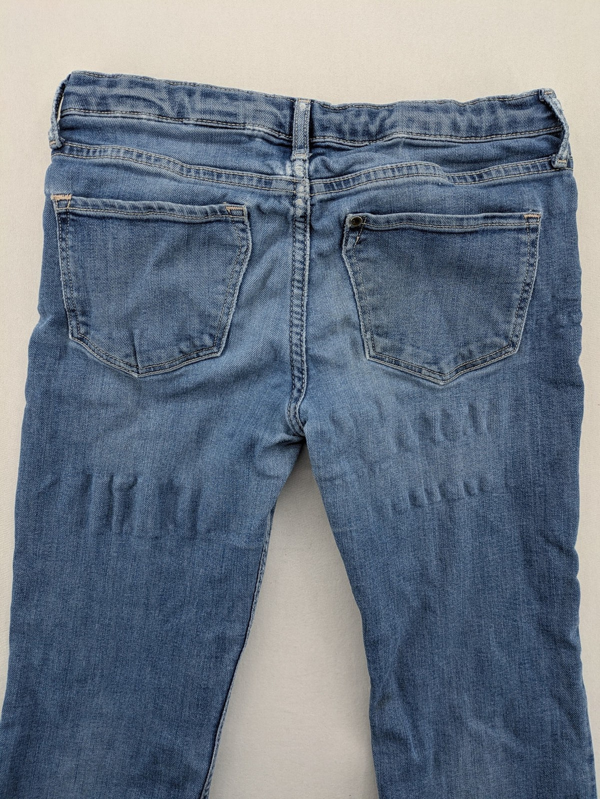 H&M blue bootcut jeans size 146, medium wash, stretch denim material.