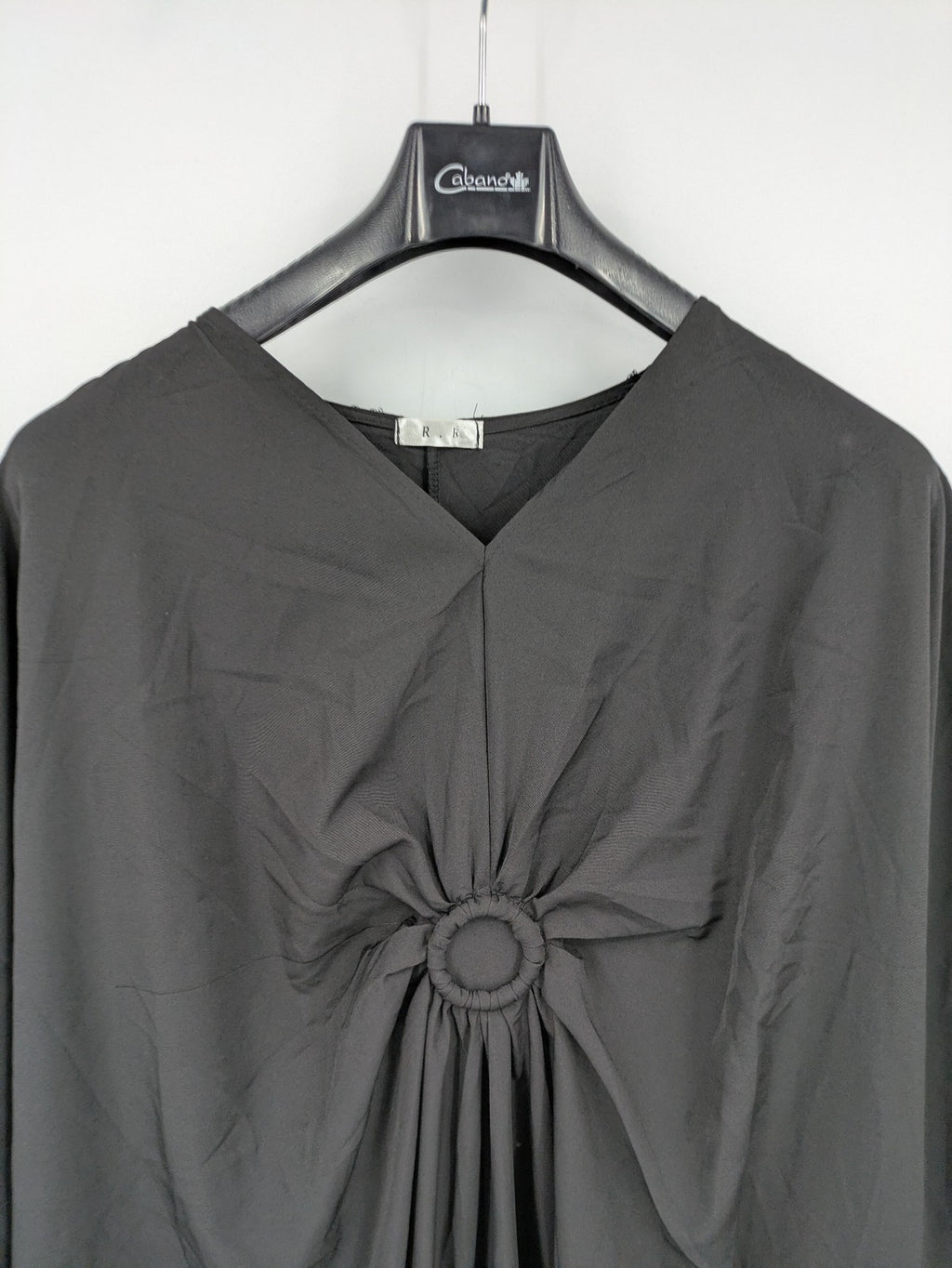 R.R grey kaftan dress with V-neck, oversized fit, and central ring detail.